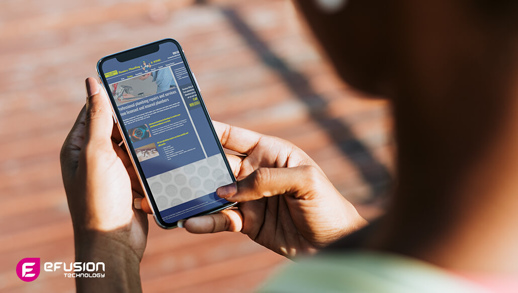 A person looking at unoptimised website design for mobile phone